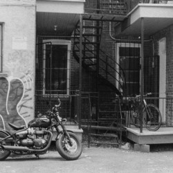 Parked Motorbike In A Montreal Alleyway In Black And White