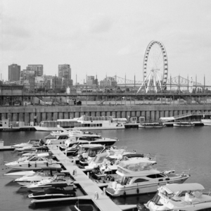 Old Port Of Montreal Marina With The Big Wheel